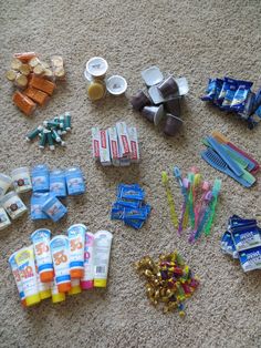 there are many different types of toothbrushes on the floor