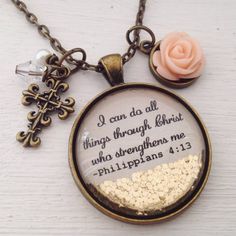 I can do all things through Christ who strengthens me large (30mm) glitter pendant with filigree cross charm, peach rise charm, clear faceted and  pearl bead dangles, available in antique brass  (as pictured) or silver finish. Chain length is 24" but can be shortened. Leave me a note at checkout if you would like it shorter. Sparkles are stationary where pictured.-not sure about the rose color? Message me for current available colors.. Luxury Jewelry Store, Bible Verse Necklace, Necklace Christian, Bead Dangles, Necklace Quotes, Resin Jewelry Diy, Philippians 4 13, Egyptian Jewelry, Jewelry Post