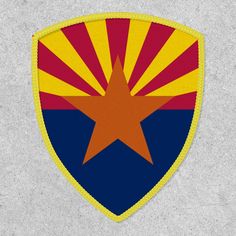 the arizona state flag is depicted on a shield shaped patch with gold and blue stripes