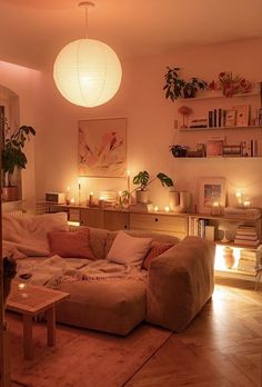 a living room filled with lots of furniture and candles on the wall next to it