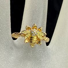 This Is A Custom Made Ring One And Only One Design. Crafted In 14k Yellow Gold. A Bumble Bee Rest On The Flower Bust. There Are Thirteen (13) Round Brilliant Diamond, 0.9-1.0mm Pave On The Bee's Head. The Flower Bust Has Eight Petal, 12mm X 12mm. 10mm Rises From The Finger. Size 6.5, Weight 3.4gm, Hallmark 14k. Bumble Bee Flower, Bee Flower, Bee On Flower, Brilliant Diamond, One Design, Womens Jewelry Rings, Bumble Bee, One And Only, Round Brilliant