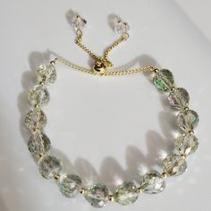 Beautiful Hints Of Green In This Amazing Swarovski Crystal Bracelet Not The Swan Logo But Austrian Swarovski Crystals Were Used To Make This Amazing Piece! Gold Plated Adjustable Chain With Two Sweet Crystal Beads Dangling On The End. This Will Fit From Very Small To Very Large Wrist. Tiny To Plus Size, You Just Slide The Adjuster, Very Easy To Wear. Perfect For A Wedding! See Video! Box 5 Listing Vintage And New Jewelry Daily, Bundle And Save, Reasonable Offers Welcome. I Sell In My Closet And Adjustable Crystal Bracelet For Wedding, Elegant Faceted Beaded Bracelets For Wedding, Faceted Crystal Bracelet For Weddings, Adjustable Crystal Beaded Bracelets For Wedding, Adjustable Faceted Beaded Bracelets For Wedding, Faceted Round Crystal Bracelet For Weddings, Elegant Crystal Beaded Bracelets With Faceted Details, Gold Crystal Beaded Bracelets For Wedding, Elegant Faceted Crystal Beaded Bracelets