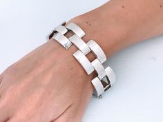 "Vintage Heavy Sterling Silver Sculptural Three Dimensional Gate Link Statement Bracelet. Bold Modernist design featuring alternating three staggered rows of rectangular silver links creating this chunky piece of art jewelry. Quality made item at 60.09 grams. Lightly cleaned ready to wear.  INSIDE CIRCUMFERENCE IS 7\" Maker Mark: 925 Stamped  Size: Approx 7.0\" Inside circumference closed. Open with safety chain is 8 1/8\", just under 1.0\" long and wide links.  Weight: 60.09 grams Condition: Go Modern Silver Chain Bracelet With Rectangular Links, Modern Silver Link Bracelet, Luxury Modern Sterling Silver Chain Link Bracelet, Luxury Silver Modernist Bracelet, Luxury Silver Brutalist Jewelry, Modernist Jewelry, Minimalist Bracelet, Statement Bracelet, Jewelry Inspo