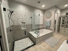 a bathroom with a walk in shower next to a bathtub and sink area,