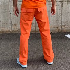 Orange is the new orange. For that convict lifestyle everyone's after. But seriously, these orange pants are power! Great fit. Great feel. Great find! The man who is actually not a convict modeling these pants is wearing a size 33 x 32 and he is 6 feet tall and weighs about 185 pounds when he's committed to P90X. Look at those arms. 100% cotton. Complete the look: orange v-neck t-shirt orange belt orange socks Orange Relaxed Fit Pants With Pockets, Relaxed Fit Orange Pants With Pockets, Casual Orange Straight Leg Pants, Orange Cotton Cargo Bottoms, Cotton Cargo Bottoms In Orange, Orange Relaxed Fit Straight Leg Bottoms, Orange Straight Leg Cotton Pants, Orange Cotton Pants For Streetwear, Orange Cotton Straight Leg Pants