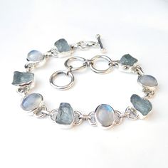 Natural Aquamarine & Rainbow moonstone 925 Sterling Silver Bracelet, Multi stone Bracelet, Gemstone Bracelet, Royal Handmade Bracelets, Product:- Ring Modal no:- U212 Metal:- 925 Sterling Silver Gemstone :- Aquamarine & Moonstone Gemstone size:- 10x12 mm Finishing:- Shiny silver We are using Pure 925 (Stamped) Sterling Silver with Natural Gemstone Jewelry, all of our jewelry designs are Handmade. We are adding new creative designs in our store regularly, for new handmade stuff please get Luxury Silver Moonstone Gemstones, Luxury Polished Sterling Silver Gemstones, Cheap Handmade Silver Crystal Bracelet, Luxury Classic Sterling Silver Gemstones, Elegant Luxury Silver Gemstones, Luxury Silver Moonstone Bracelets, Silver Bracelets With Natural Moonstone, Sterling Silver Bracelet With Gemstone And Moonstone, Silver Moonstone Bracelet With Natural Stones