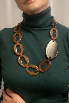 This brown  statement necklace is a modern accessory to wear on any occasion a superb anniversary gift for wife, adding a touch of contemporary elegance to her outfit.  The necklace is made of natural sustainable material, horn in brown colour, all hand made Size: 71 cm (27.9"), each link is about 5 cm (1.9"), the black connector (horn) is 8 cm (3") oval shape. Horn links are considered ecological because they are used from renewable resource and are biodegradable. My style is very wearable and Modern Brown Jewelry For Parties, Chic Brown Handmade Jewelry, Chic Handmade Brown Jewelry, Chic Brown Formal Jewelry, Elegant Long Brown Necklace, Elegant Handmade Brown Necklace, Elegant Brown Chain Necklace As Gift, Modern Handmade Long Necklace, What Jewelry To Wear