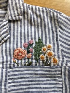 Wildflower embroidery on a shirt by Melissa Galbraith; Melissa Galbraith turned her hobby of stitching into a small business and now teaches people how to embroider, creates kits, and has written two books on creative stitching.