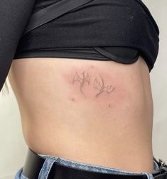 a woman's stomach with the word love written in cursive writing on it