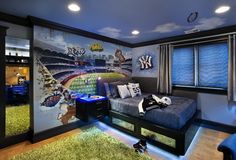 a bedroom decorated with sports themed wallpaper and blue walls, along with green carpeted flooring