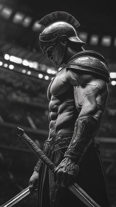 a black and white photo of a roman soldier holding two swords in front of an arena