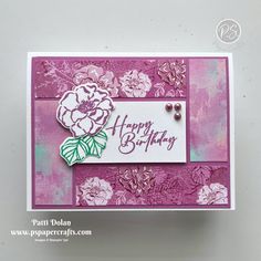 a close up of a greeting card with flowers on the front and bottom, which says happy birthday