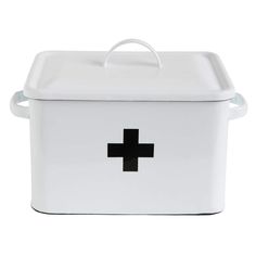 a white box with a black cross on the lid and handle is shown in front of a white background