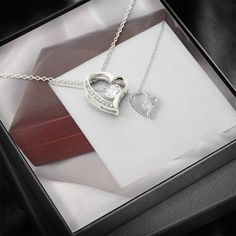 Give a loving gift that will make her heart melt! This dazzling Forever Love Necklace features a polished heart pendant surrounding a flawless 6.5mm cubic zirconia, embellished with smaller crystals adding extra sparkle and shine. The pendant is crafted in 14K white gold finish and dangles from an adjustable cable chain secured with a lobster clasp. DIMENSIONS: ▶ 14K white gold finish ▶ Adjustable cable chain 18" - 22" ▶ 6.5mm round cut cubic zirconia ▶ Height 0.8" (2.2cm) Width 0.7" (1.8cm) PERFECT FOR: Birthday Gift, Thanksgiving Day Gift, Christmas Gift, New Years Gift, Best Friend Gift, Family Gift, Valentines Day Gift, Mother Necklace, Daughter Necklace, Promise Necklace, Daily-wear Necklace. Dazzling Heart-shaped Jewelry For Gifts, Dazzling Heart Shaped Jewelry For Gifts, Dazzling Heart-shaped Jewelry Gift, Elegant Personalized Cubic Zirconia Heart Necklace, Elegant Personalized Heart Necklace With Cubic Zirconia, Elegant Personalized Heart Necklace In Cubic Zirconia, Silver Crystal Heart Necklace For Anniversary, Sparkling Crystal Jewelry For Gift, Sparkling Crystal Jewelry Gift