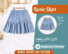 the skirt is blue and white with flowers on it