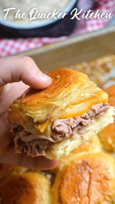 three sandwiches stacked on top of each other with cheese and meat in the middle,