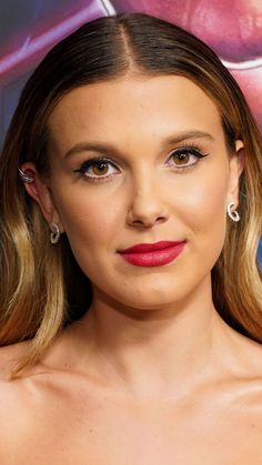 a close up of a person wearing red lipstick