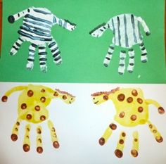 two handprints made to look like zebras and giraffes