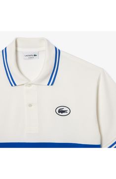 Sporty and French-inspired, this classic-fit polo features placed stripes, tipped edges and a silicone logo at the chest for iconic Lacoste style. 28" length Button half placket Spread collar Short sleeves 100% cotton Hand wash, line dry Imported Classic Polo Shirt With Contrast Stripes, Classic Polo Shirt With Signature Stripes, Classic Blue Polo Shirt With Contrast Stripes, Classic Collared Polo Shirt With Signature Stripes, White Collared Polo Shirt With Signature Stripes, White Sporty Polo Shirt With Contrast Collar, Classic Three-stripes Polo Shirt, Classic Three Stripes Polo Shirt, Sporty Blue Polo Shirt With Contrast Stripes