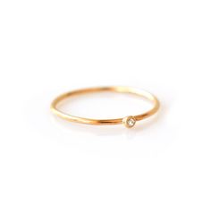 The most versatile and dainty piece in our collection, this solo diamond ring can be stacked with nearly everything. Simplistic and minimalist, it adds extra sparkle to any ring stack. Product Description: solid 14kt gold; 1mm ring band; 1pt diamond (clarity VS1/2) and (size 0.25 carats) Rings Box, Engagement Rings Halo, Cheap Diamond Rings, Expensive Rings, Rings Solitaire, Trio Ring, Gold Rings Simple, Beautiful Diamond Rings, Diamond Stacking Rings