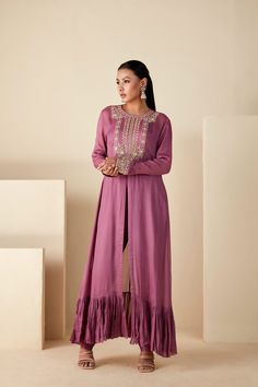 Embrace regal elegance with our Mauve Majesty Zardosi Kurta Set. Adorned with exquisite hand-embroidered zardosi, this set pairs a detailed kurta with sleek slim-fit pants for a modern twist. The luxurious georgette crepe and Tussar silk blend, in a delicate mauve, ensure a graceful drape with a comfortable fit. Elegant Raw Silk Sets For Navratri, Elegant Chanderi Sherwani For Receptions, Elegant Art Silk Sets With Resham Embroidery, Elegant Chanderi Sherwani With Resham Embroidery, Elegant Semi-stitched Georgette Sherwani, Elegant Georgette Sherwani For Eid, Elegant Georgette Sherwani With Resham Embroidery, Designer Fitted Sherwani In Georgette, Anarkali-style Embellished Sherwani With Traditional Drape