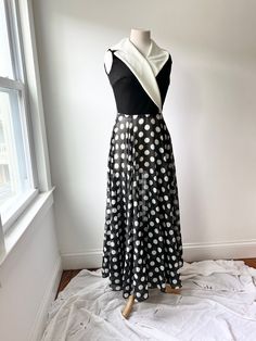 vintage 70s polka dot maxi dress flowy and sheer summer dress  size sm- med No tags on sizing or fiber content or designer Top feels like a poly blend and bottoms skirt feels like a sheer cotton This does have belt loops Zipper closure back very good condition with a tiny section of the hem the stitch is coming undone Looks to be a size small, bit snug on my med size mannequin Measurements: Length: 55" Chest: 17" Waist: 12.5" Measurements are taken flat Measurements: please allow a little extra Polka Dot Summer Maxi Dress, Fitted Polka Dot Maxi Dress, Elegant Polka Dot Maxi Dress For Summer, Fitted Polka Dot Maxi Dress For Spring, Polka Dot Maxi Dress For Summer Evenings, Polka Dot Maxi Length Evening Dress, Summer Evening Polka Dot Maxi Dress, Chic Flowy Polka Dot Dress, Chic Polka Dot Maxi Dress