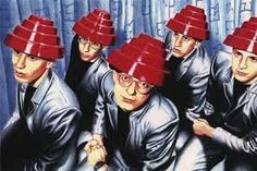 a group of people with red hats on their heads