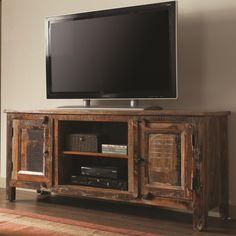 an entertainment center with a flat screen tv on it's stand, and the words coaster company 70383 accent