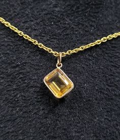 1. 18k Gold Citrine Quartz Pendant 2. Made to Order 3. Gemstone - Citrine Quartz 4. Jewelry Type - Pendant 5. Total weight - 0.980 Gram Approx 6. Citrine Weight - 3.60 Carats 7. Shape - Octagonal 8. Gold Weight - 0.260 Grams Approx. 9. Gold Purity - 18k 10. Citrine Size - 8 × 10 mm Approx. 11. Cut - Emerald 12. Ready to dispatch in 1 - 2 days. 13. Handmade Items 14. AAA Quality Pendant 15. 1 Quantity Available 16. Chain is not inclusive Pictures are taken under natural and day light. Gold Briolette Birthstone Necklace In Fine Jewelry Style, Gold Briolette Birthstone Necklace, Gold Briolette Birthstone Necklace Fine Jewelry, Classic Citrine Gemstone Necklace, Faceted Pendant Necklaces For Anniversary, Classic Faceted Pendant Necklace, Hallmarked Briolette Necklace For Gift, Fine Jewelry Citrine Bezel Setting, Faceted Yellow Gold Round Pendant Necklace