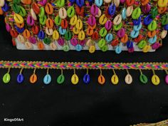 colorful beads and chains are hanging on the wall