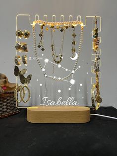 a display case with many different necklaces on it