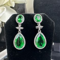 Description Pear-Shaped Emerald (Lab Created) With Cubic Zirconia Accent Stones White Gold Plated Sterling Silver Handmade Condition Pristine Details For Pierced Ears Main Stone 16x10 Mm Halo Style Pav Halo Style, Pierced Ears, Gold Plated Sterling Silver, Pear Shaped, Handmade Silver, Ear Piercings, Statement Earrings, Halo, Pear