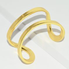 Designed to wrap your wrist in glistening shine, this sinuous wrist cuff is both sculptural and minimalist. * Cuff slightly adjustable to fit most *PRODUCT DETAILSMaterials: Pewter casting with either 24 kt gold plating / Sterling silver plating / Rose gold plating.Measurements: 2" width. As seen on Fifth Harmony Singer Camila Cabello: Wows the Teen Choice Awards crowd with her all black outfit and Elise split cuff she chooses to wear on her upper arm. This cuff is so volatile it can be worn man Modern Adjustable Cuff Bangle, Modern Twist Cuff Bracelet For Formal Occasions, Modern Adjustable Cuff Bracelet, Modern Adjustable Cuff Bracelet For Party, Modern Adjustable Cuff Bracelet For Parties, Adjustable Modern Cuff Bracelet For Party, Adjustable Contemporary Cuff Bracelet, Modern Adjustable Open Cuff Bracelet, Modern Gold Double Band Cuff Bracelet