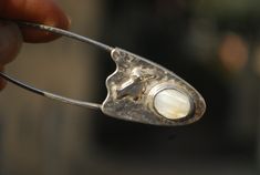 Handmade jewelry bird shawl safety pin brooch with Mother of Pearl. Unique handmade jewelry gift for woman. Large safety pin brooch for shawl, scarf, sweater or kilt. Sterling silver handmade jewelry.  Silversmith brooch with Mother of pearl and bird for woman.  Coat brooch / scarf pin / kilt pin / sweater pin brooch.  Ready to ship  Our other works:  https://www.etsy.com/shop/FaunaSilverGems Coat Brooch, Brooch Scarf, Woman Coat, Scarf Sweater, Large Safety Pin, Unique Sweater, Sweater Pin, Safety Pin Brooch, Kilt Pin