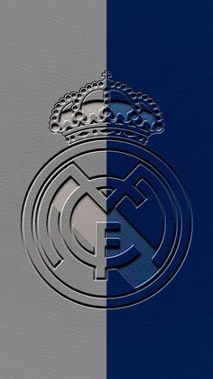 the real madrid logo is shown in silver and blue colors, with a crown on top