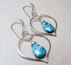 "Offered are my very elegant sterling silver and turquoise earrings! The turquoise is a very high grade Mojave turquoise that have \"been pressure stabilized, a bronze substance added to create the veining and color added to create the beautiful different colour hues.\" It's stunning! I coupled them with Balinese made sterling silver lotus leaf shaped components for a truly elegant and original pair of earrings! I have enough stones for ONLY THREE (3) PAIRS! These are so versatile - great for wo Turquoise Earrings For Anniversary, Turquoise Earrings For Anniversary With Pierced Ears, Turquoise Sterling Silver Pierced Jewelry, Pierced Turquoise Sterling Silver Jewelry, Turquoise Earrings In Sterling Silver, Turquoise Pierced Earrings For Anniversary, Handmade Turquoise Earrings For Anniversary, Turquoise Dangle Earrings For Anniversary, Turquoise Teardrop Jewelry For Anniversary