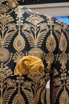 Elevate your style with our exquisite Deep Green Prince Coat with Golden Embroidery Work. This luxurious piece is crafted from raw silk fabric and adorned with intricate golden embroidery, making it the perfect choice for any special occasion. For online prices plz visit: https://uomoattire.com/ or ☎️ Call/WhatsApp on +92300-7668666 / 0300-7618666 #deepgreenprincecoat #goldenembroiderywork #groomwear #weddingattire #formalwear #traditionalshowcase #luxurious #elegant #sophisticated #madetorule Elegant Brocade Embroidered Fabric For Reception, Formal Art Silk Fabric With Zari Embroidery, Elegant Silk Sherwani With Intricate Embroidery, Gold Embroidered Raw Silk Fabric For Reception, Embroidered Brocade Wedding Sets, Embroidered Silk Sherwani For Party, Elegant Brocade Fabric With Traditional Drape, Elegant Brocade Embroidered Fabric With Traditional Drape, Party Silk Sherwani With Embroidery