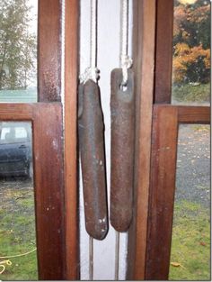 an old door handle is hanging on the side of a house