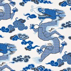 a blue and white dragon pattern with clouds