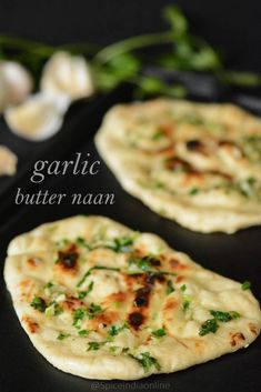 garlic butter naan on a black plate