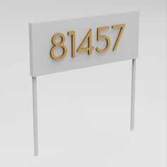 a white sign with gold numbers on it that says,'81457 '