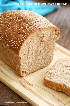 a loaf of bread sitting on top of a wooden cutting board