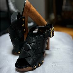 Black Platforms Chic Black Sandals With Wooden Heel, Luxury Black Heels With Stacked Heel, Black Leather Heels With Wooden Heel, Designer Black Heels With Wooden Heel, Designer Black Heels With Buckle Closure, Black Tory Burch Boots, Tori Burch Sandals Black, Pink Orchids, Black Platform