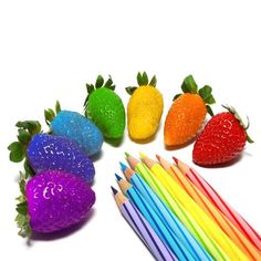 several different colored pencils are arranged in the shape of strawberries and strawberrys