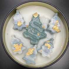 a white plate topped with blue and gold cookies