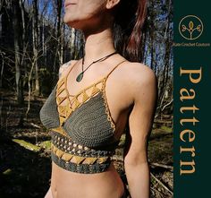 a woman wearing a crochet top in the woods looking up at something off camera