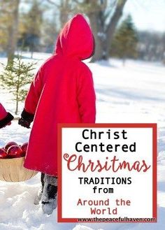 two children in red coats are standing in the snow with a basket of apples on their lap