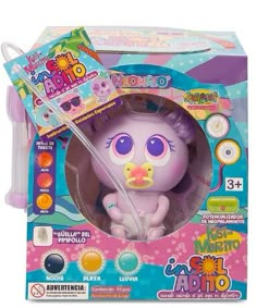 an animal toy with purple hair and blue eyes in a pink package on a white background