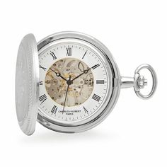 PRODUCT DESCRIPTIONThe classic look of silver and timeless design of this Charles Hubert pocket watch will add sophisticated style to his professional wardrobe. The watch cover is made of polished silver-plated steel, embossed with a shield that can be engraved with his initials for free! Inside, a white dial, with black Roman numerals and hands, surrounds the inner mechanism, and is visible from front and back. The charming pocket watch comes with a matching chain, and is packaged in a Charles Liquor Flask, Flask Set, Mechanical Pocket Watch, Pocket Watch Antique, Pocket Watch Chain, Pocket Watches, Polish Silver, Watch Chain, Black Hand