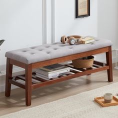 a wooden bench sitting on top of a hard wood floor next to a white rug